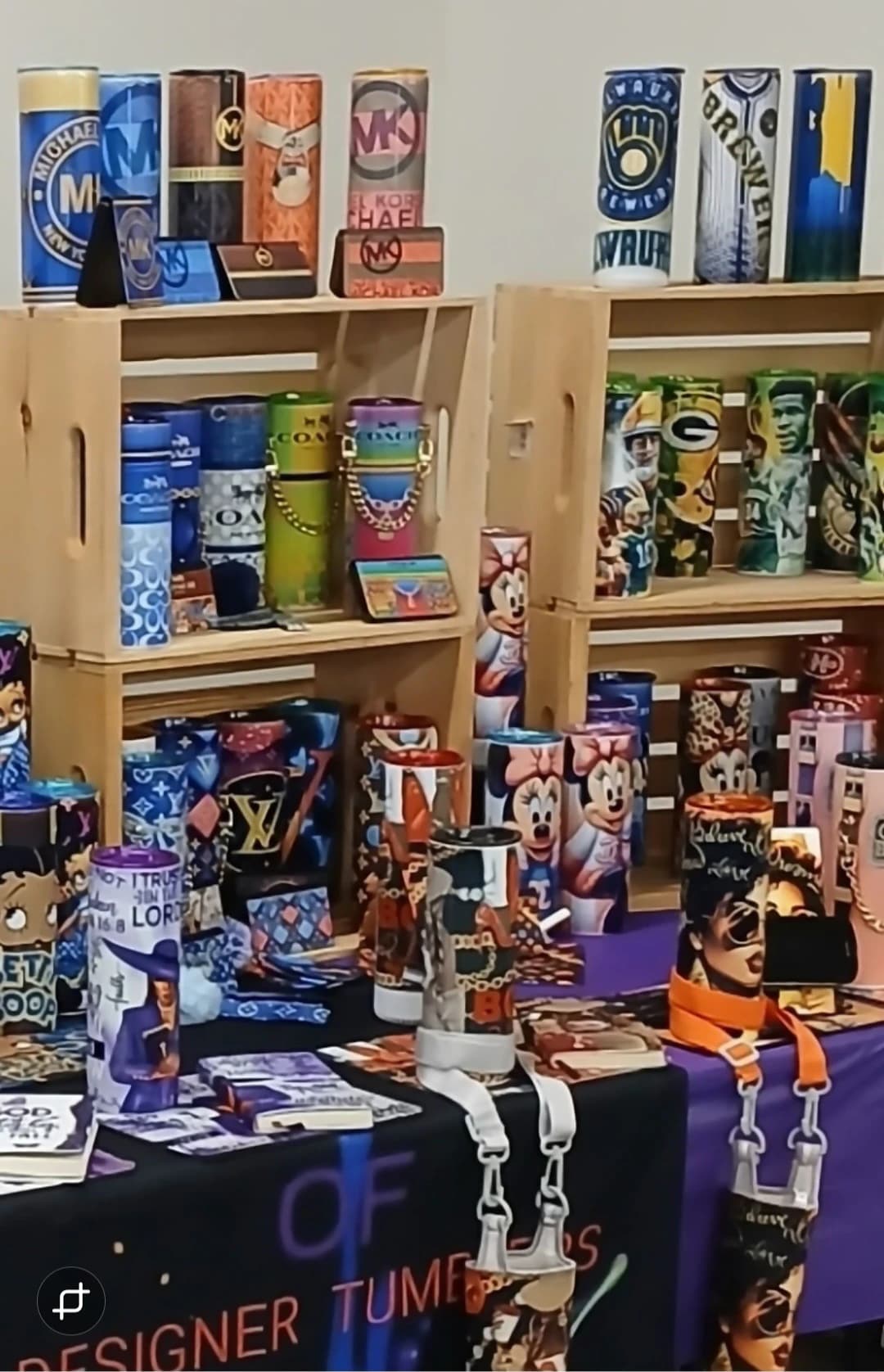 A'Splash of Ella-Ganze vendor display filled with designer stainless-steel tumblers and accessories