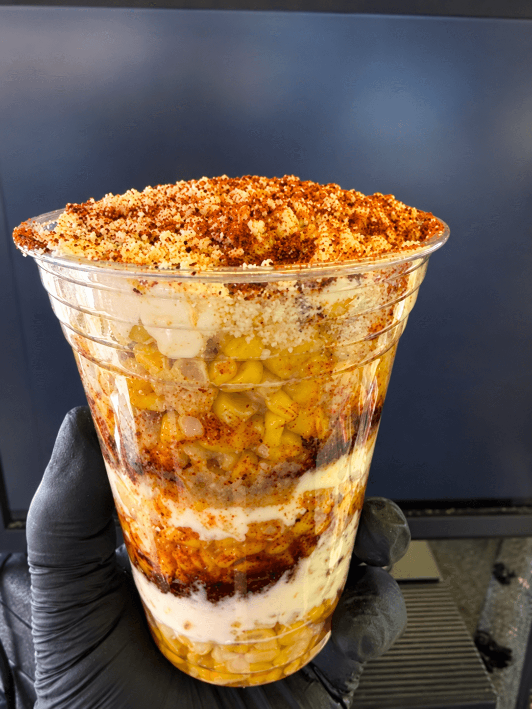 King's Cup elote layered in a clear cup